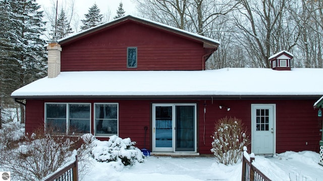 view of snow covered house