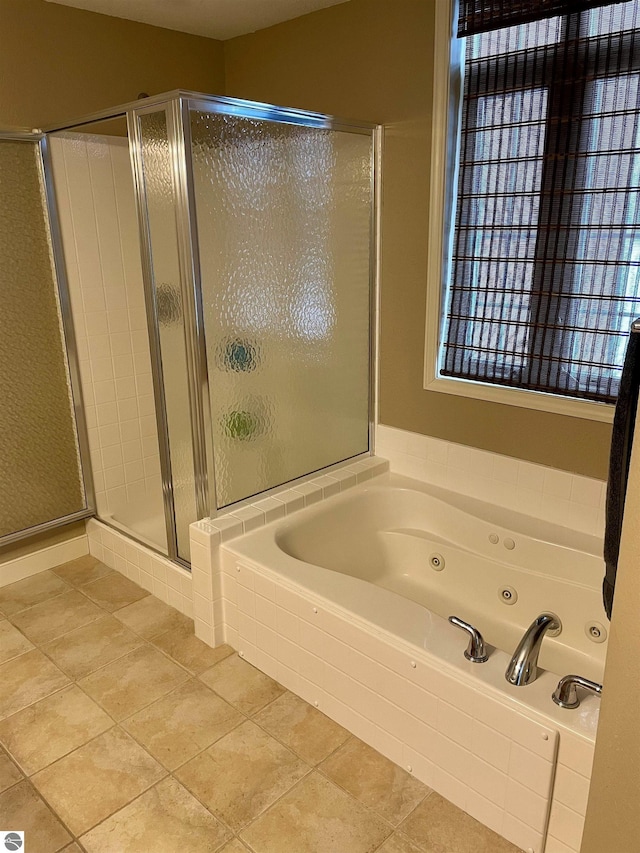 bathroom featuring plus walk in shower and tile patterned floors