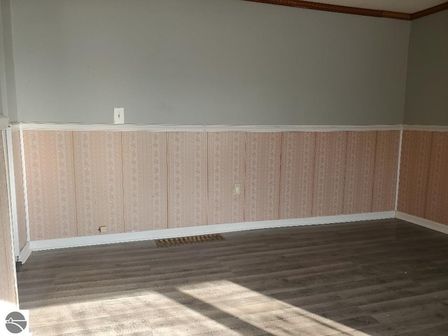 spare room featuring dark hardwood / wood-style floors