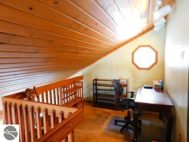 office with wooden ceiling and vaulted ceiling