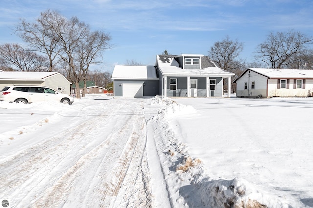 view of front of property featuring a garage and covered porch