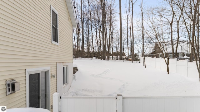 view of yard layered in snow