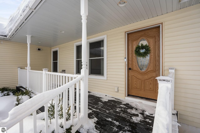 view of snow covered property entrance