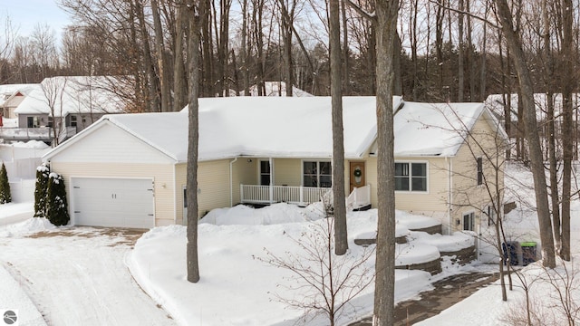 view of front facade featuring a garage and covered porch