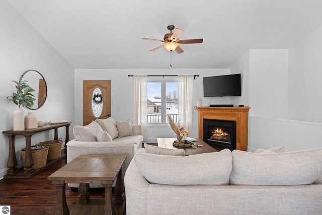 living room featuring lofted ceiling, dark hardwood / wood-style floors, and ceiling fan