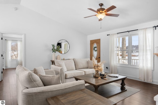 living room featuring lofted ceiling, dark hardwood / wood-style flooring, and ceiling fan