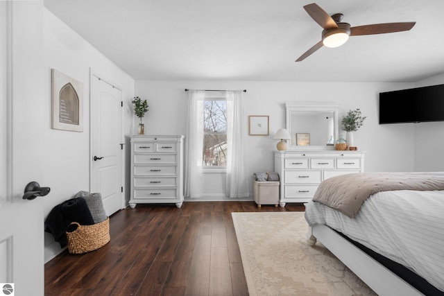 bedroom with dark wood-type flooring and ceiling fan