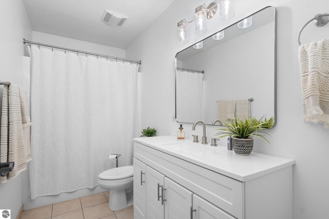 full bathroom featuring tile patterned flooring, vanity, shower / bath combo, and toilet