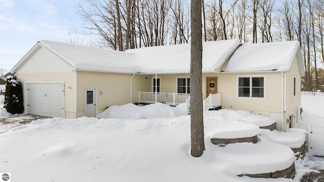 view of front of property featuring a garage and covered porch