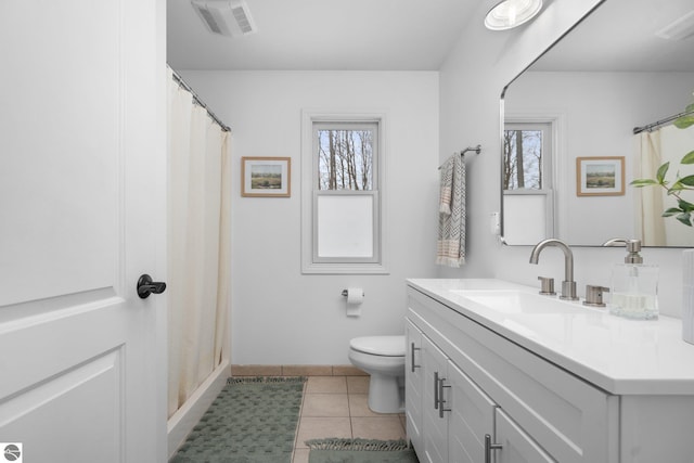 bathroom with tile patterned flooring, vanity, toilet, and a shower with shower curtain