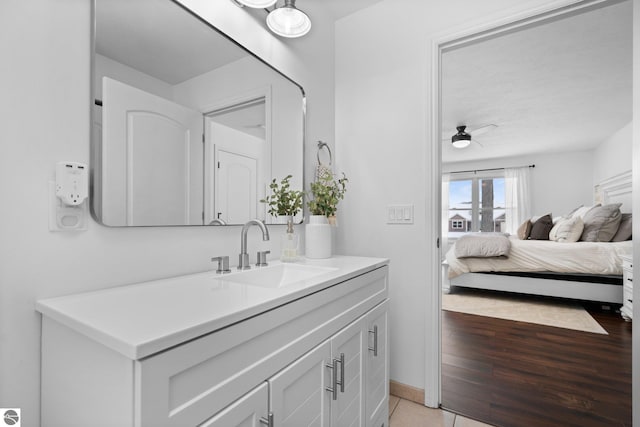 bathroom with vanity, wood-type flooring, and ceiling fan