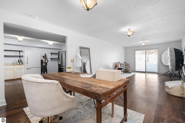 dining room with dark hardwood / wood-style floors