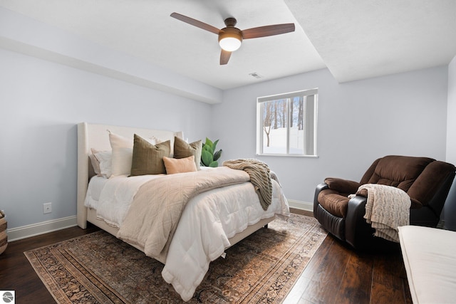 bedroom featuring dark hardwood / wood-style flooring and ceiling fan