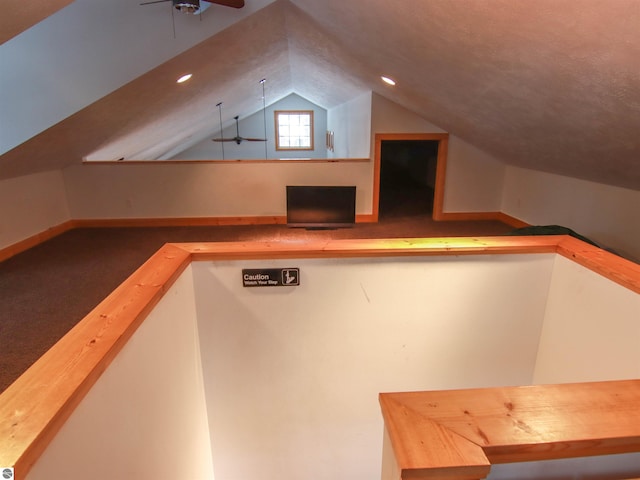 bonus room featuring lofted ceiling and ceiling fan