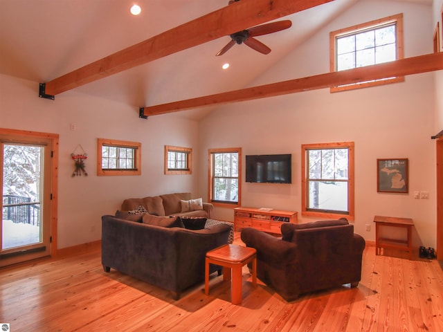 living room featuring light hardwood / wood-style flooring, high vaulted ceiling, and beamed ceiling