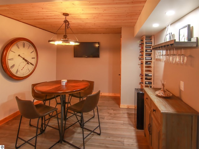 dining space featuring wood ceiling and light hardwood / wood-style floors