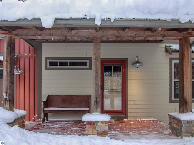 view of snow covered property entrance