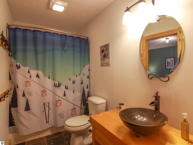 bathroom featuring tile patterned flooring, vanity, a shower with curtain, and toilet