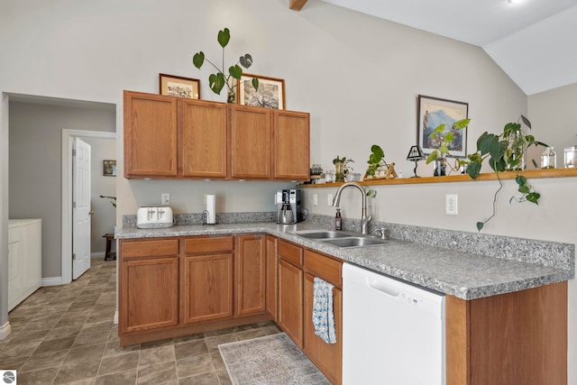 kitchen with lofted ceiling, sink, dishwasher, kitchen peninsula, and washing machine and dryer