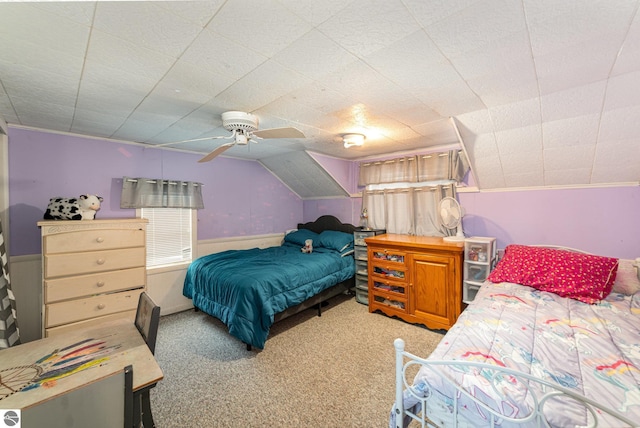 bedroom featuring lofted ceiling, light colored carpet, and ceiling fan