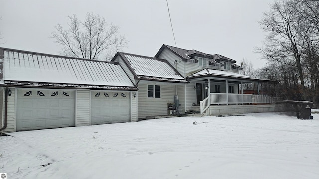 view of front facade featuring a porch and a garage