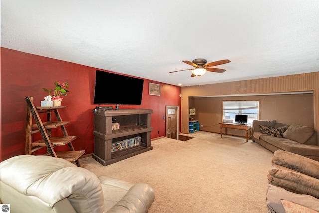 carpeted living room featuring ceiling fan