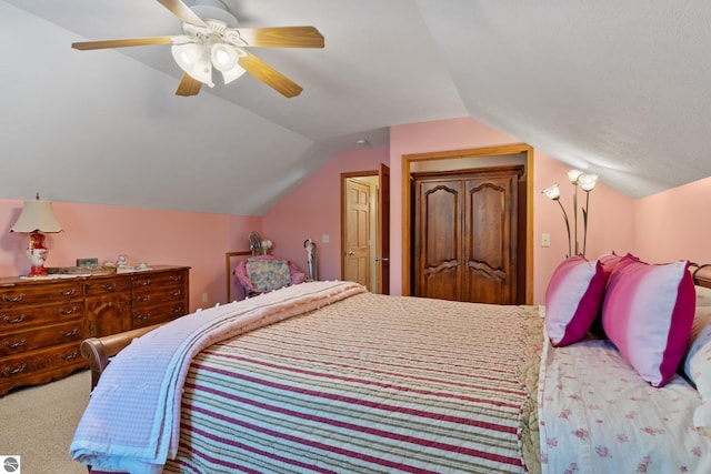 carpeted bedroom with lofted ceiling and ceiling fan