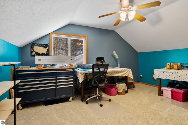 office with light carpet, vaulted ceiling, and a textured ceiling