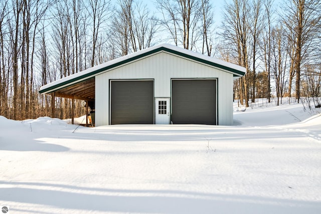 view of snow covered garage