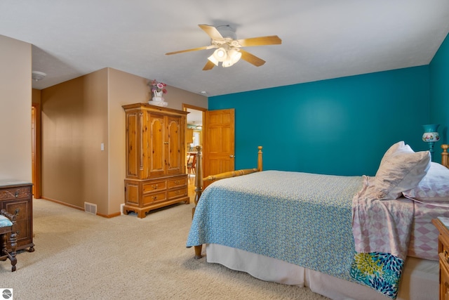 carpeted bedroom featuring ceiling fan