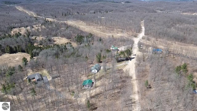 birds eye view of property with a rural view and a forest view