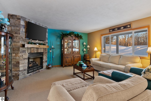 living room with a stone fireplace and carpet