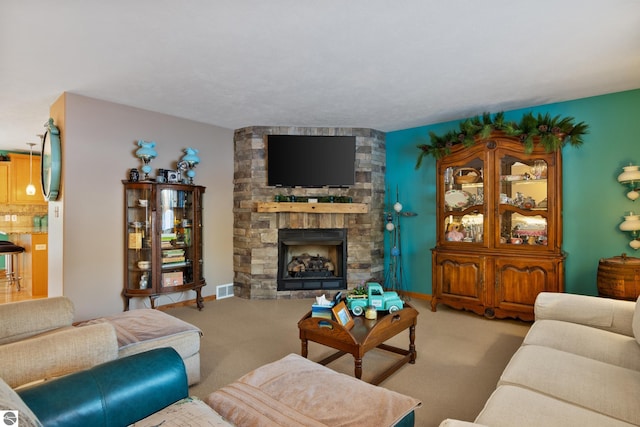 carpeted living room with a fireplace