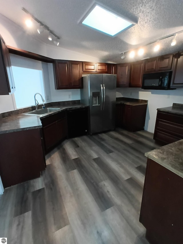 kitchen featuring sink, dark hardwood / wood-style flooring, stainless steel fridge with ice dispenser, dark brown cabinets, and a textured ceiling