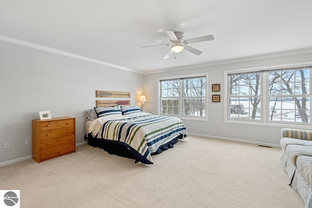 bedroom featuring crown molding, light colored carpet, and ceiling fan