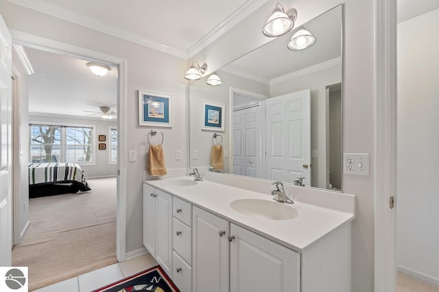 bathroom featuring tile patterned flooring, crown molding, vanity, and ceiling fan