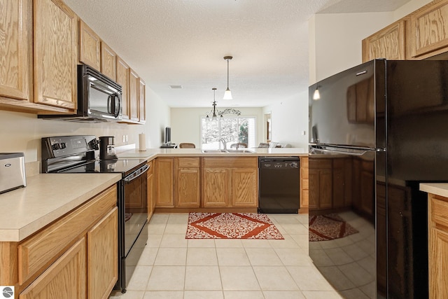 kitchen with hanging light fixtures, sink, a textured ceiling, and black appliances