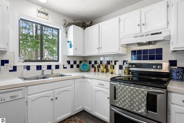 kitchen featuring sink, stainless steel electric range, and white cabinets