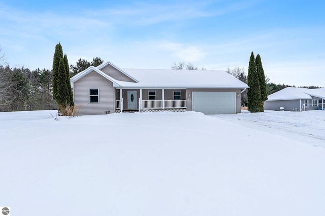 ranch-style home with a garage and covered porch