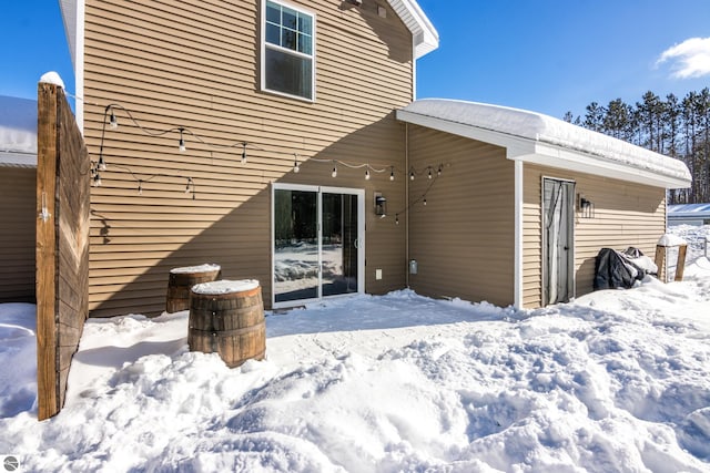 view of snow covered house