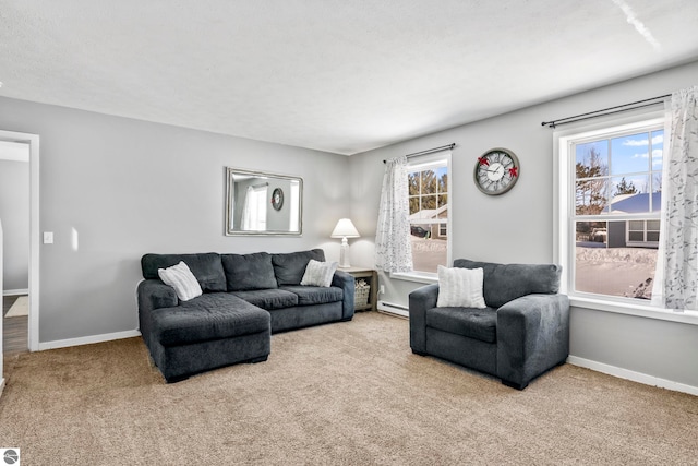 carpeted living room with a baseboard heating unit