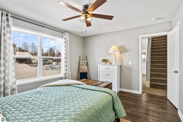 bedroom with ceiling fan and dark hardwood / wood-style flooring