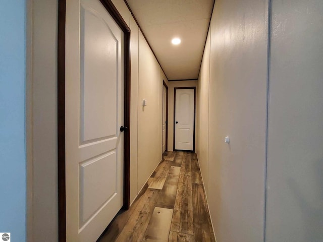 hallway with light hardwood / wood-style floors