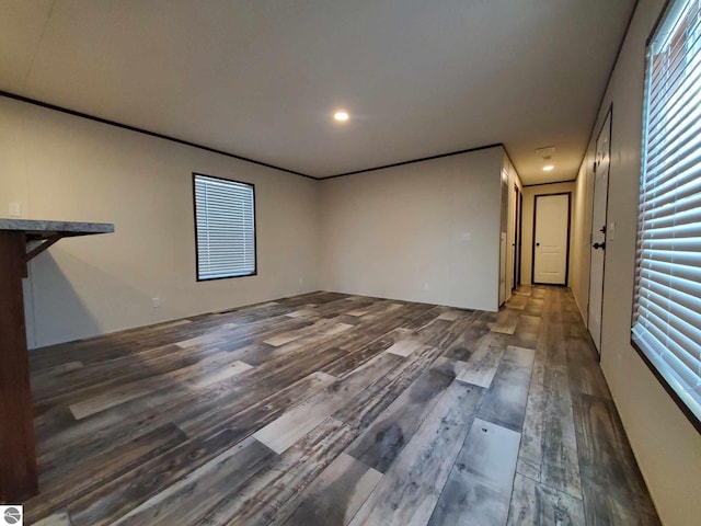 empty room with dark hardwood / wood-style flooring