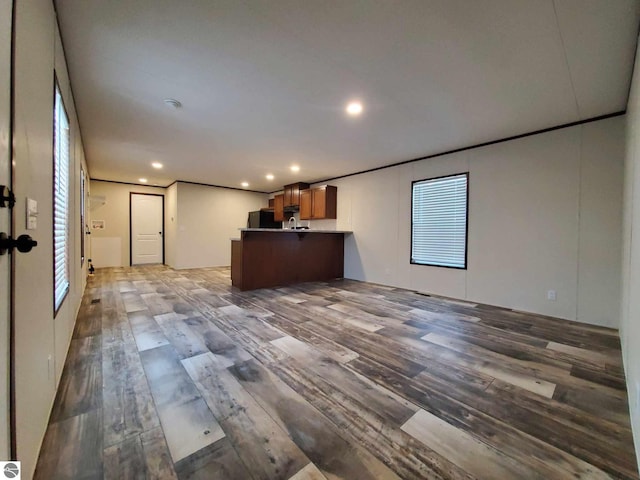 interior space featuring a healthy amount of sunlight and dark hardwood / wood-style flooring