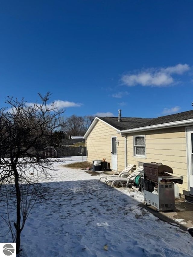 view of snow covered house