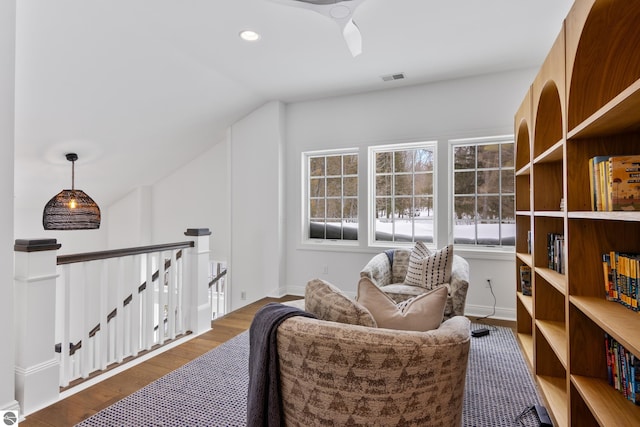 sitting room featuring vaulted ceiling, ceiling fan, and wood-type flooring