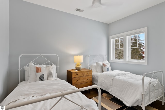 bedroom featuring hardwood / wood-style flooring and ceiling fan