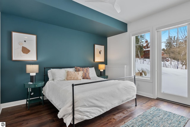 bedroom featuring dark hardwood / wood-style flooring and access to outside