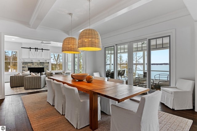 dining room featuring a fireplace, french doors, ornamental molding, beamed ceiling, and dark hardwood / wood-style floors